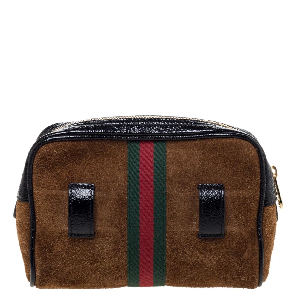 The Gucci bag has been exquisitely crafted from suede as well as patent leather and is equipped with a suede interior. The exterior features signature elements and the adjustable belt is provided for you to style the piece as a waist bag.

Includes: