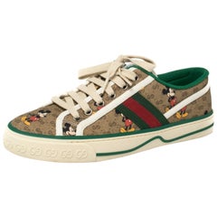 Gucci - Baskets basses en toile enduite marron édition Disney Taille 38