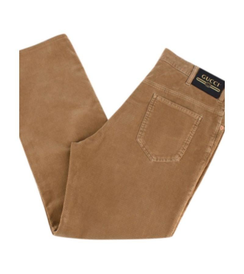 Gucci Brown Corduroy Trousers

- Brown, soft corduroy Gucci trousers
- Bronze-coloured, metal hardware features
- Large, black leather and gold embossed logo patch on back right hip

Materials:
Cotton
Metal
Leather

Made in Italy
Dry-clean
