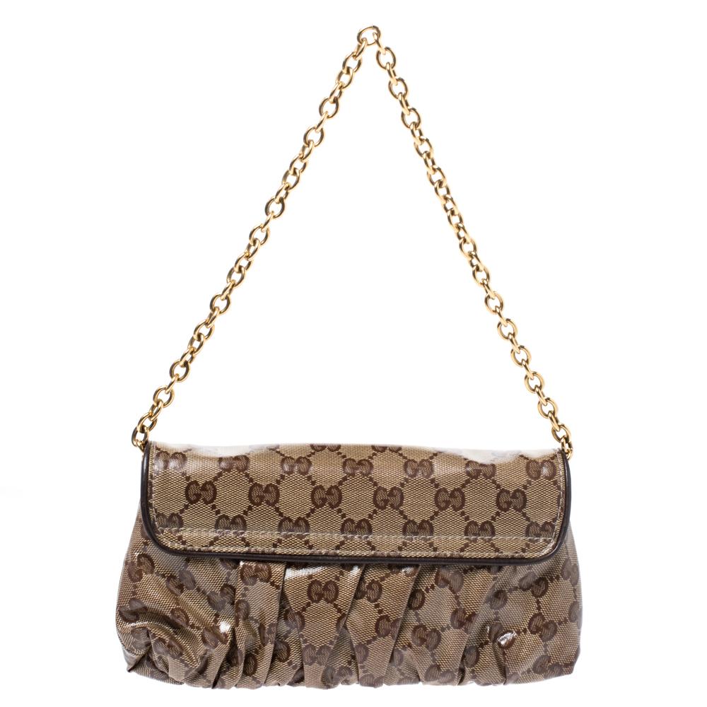 This gorgeous evening bag from Gucci is the perfect evening accessory! Crafted in Italy, it is made of the brand's signature Crystal coated canvas. It comes in a lovely shade of brown and features a front flap adorned with a gold-tone Gucci emblem.