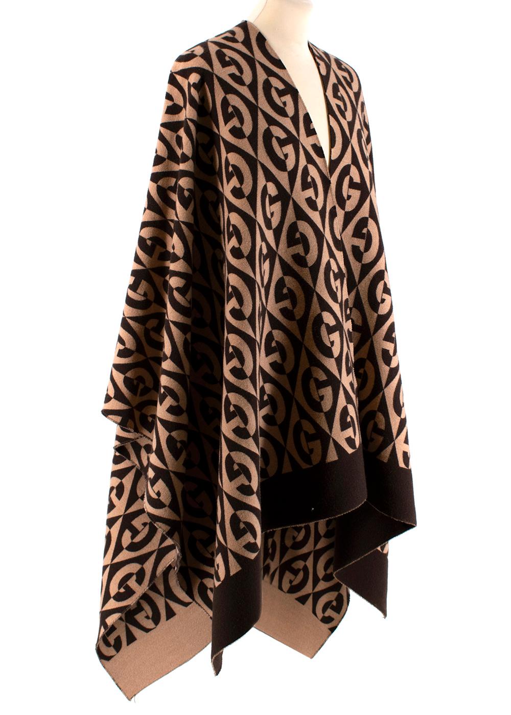 Gucci Brown G Rhombus Poncho

-Dark and Light Brown
- 91% Wool 
- 9% Cotton 
- Very Soft 
- G logo 
- Reversible 

PLEASE NOTE, THESE ITEMS ARE PRE-OWNED AND MAY SHOW SIGNS  OF BEING STORED EVEN WHEN UNWORN AND UNUSED. THIS IS  REFLECTED WITHIN THE