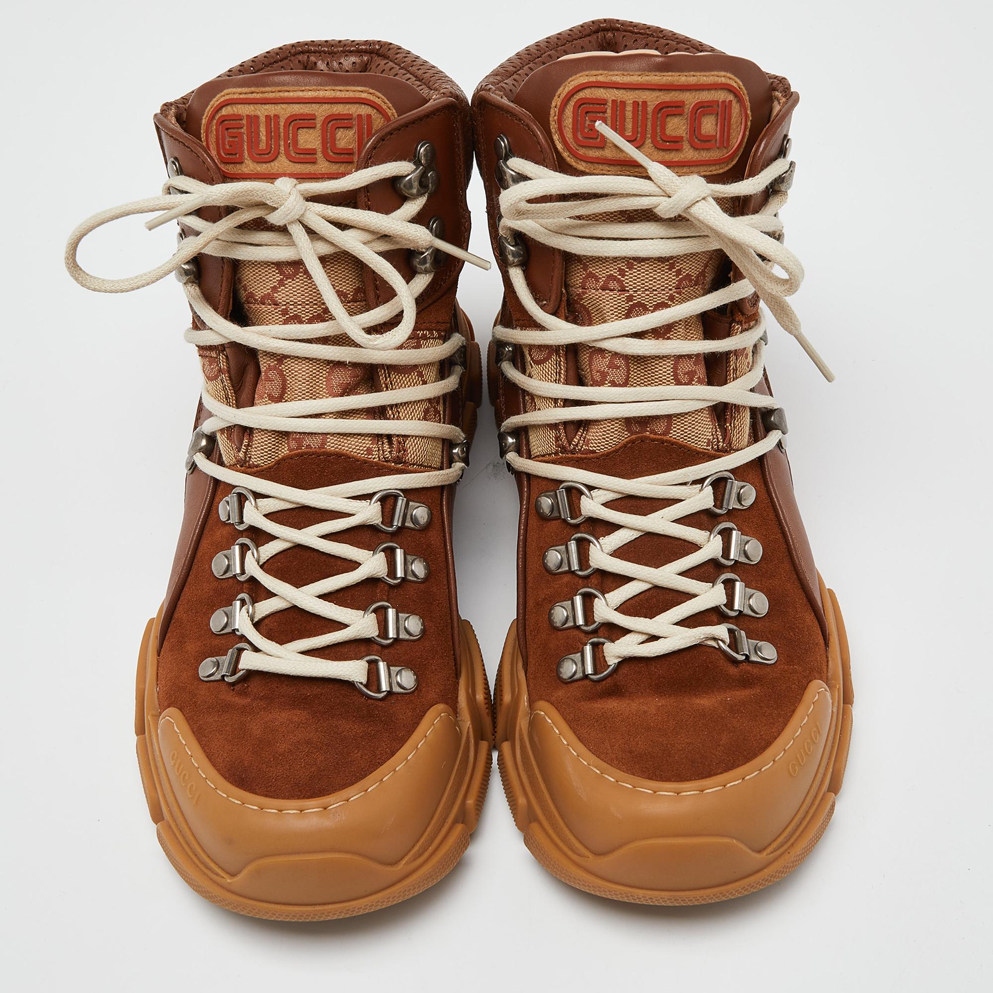 Don't miss out on making these sneakers yours this season. Crafted from GG canvas, suede & leather, these Gucci Journey Hiker boots feature lace-up vamps, rubber soles, and leather insoles for added comfort.

Includes: Original Dustbag

