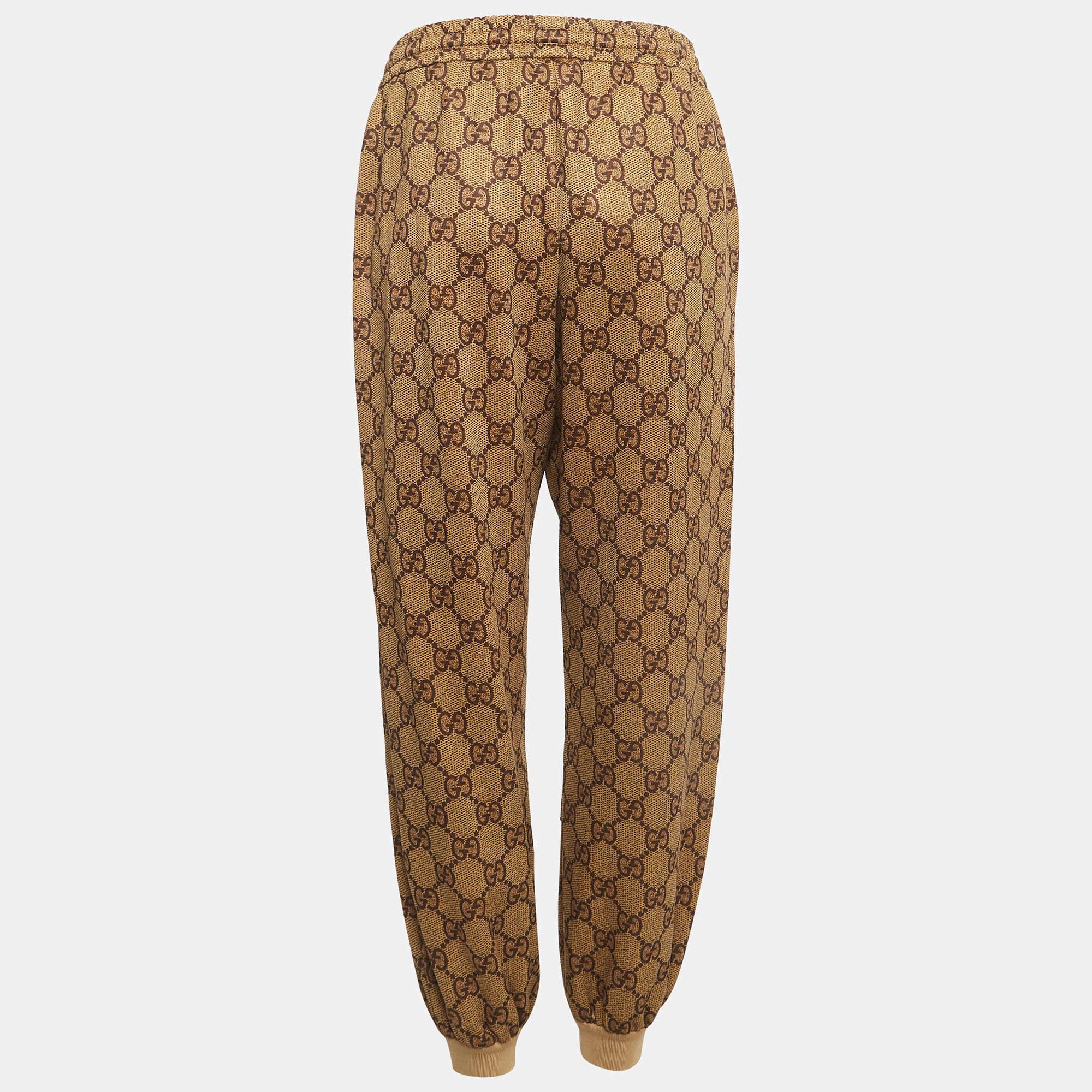 Gucci's track pants are defined by the signature monogram prints all over. Flaunting a brown shade, they offer a great fit and will look good with a tee and sneakers.

