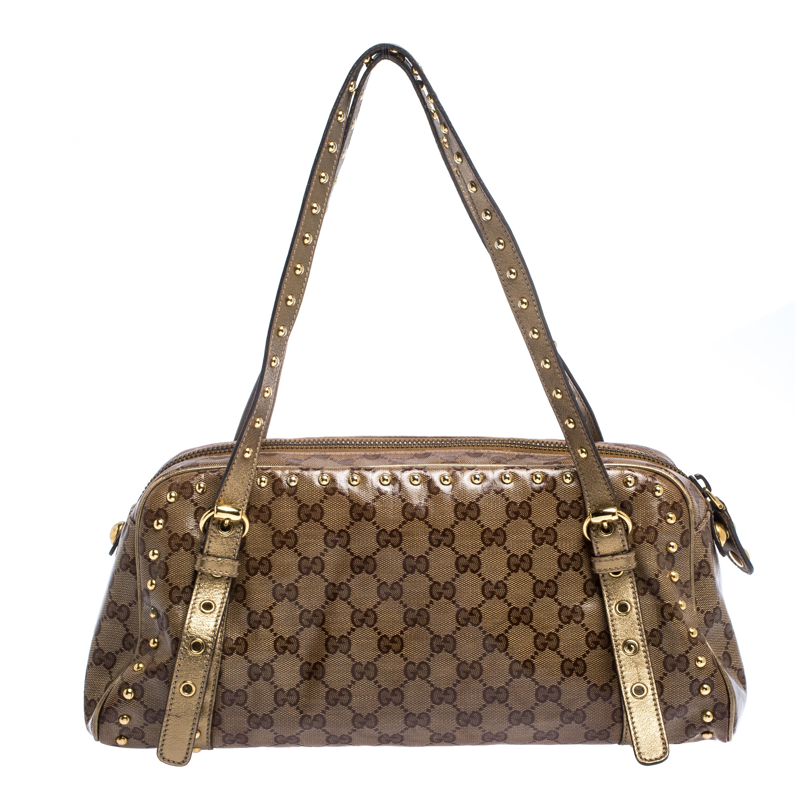 There is no mistaking this tote to be by anyone other than Gucci. It has a canvas body covered in the brand's signature GG Crystal pattern. The brown/gold bag has two handles and a spacious fabric interior for your essentials.

