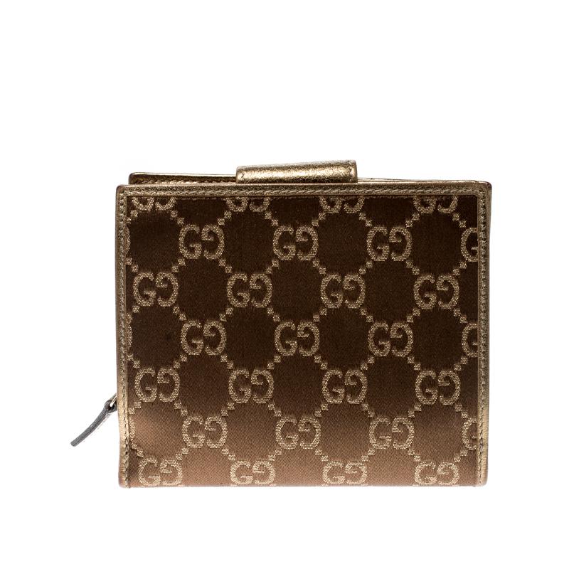 Stay organised in style with this wallet from Gucci. It is crafted from GG satin and leather and it has the D ring motif on the front. The wallet features a zip compartment and the snap button reveals multiple card slots and compartments for