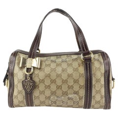 Gucci Braune Gucci GG Kristall Duchessa Boston Tasche 927G1