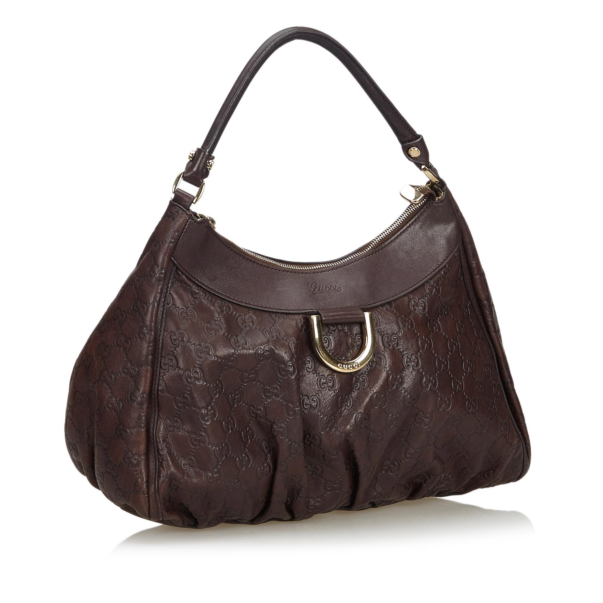 The Abbey D-Ring shoulder bag features a leather body, a rolled leather handle, a top zip closure, and an interior zip pocket. It carries as B condition rating.

Inclusions: 
This item does not come with inclusions.

Dimensions:
Length: 23.00