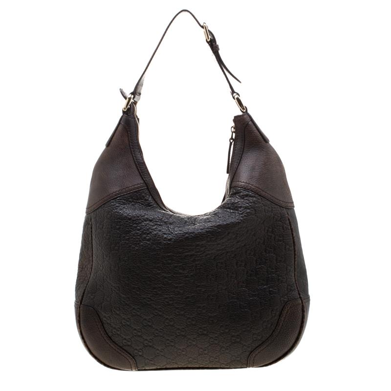 This brown Gucci Catherine hobo is crafted from signature Guccissima leather. The bag features a single handle and a horsebit buckle adorns its front. The top zip closure opens to a fabric-lined interior that houses a zip pocket and it is convenient