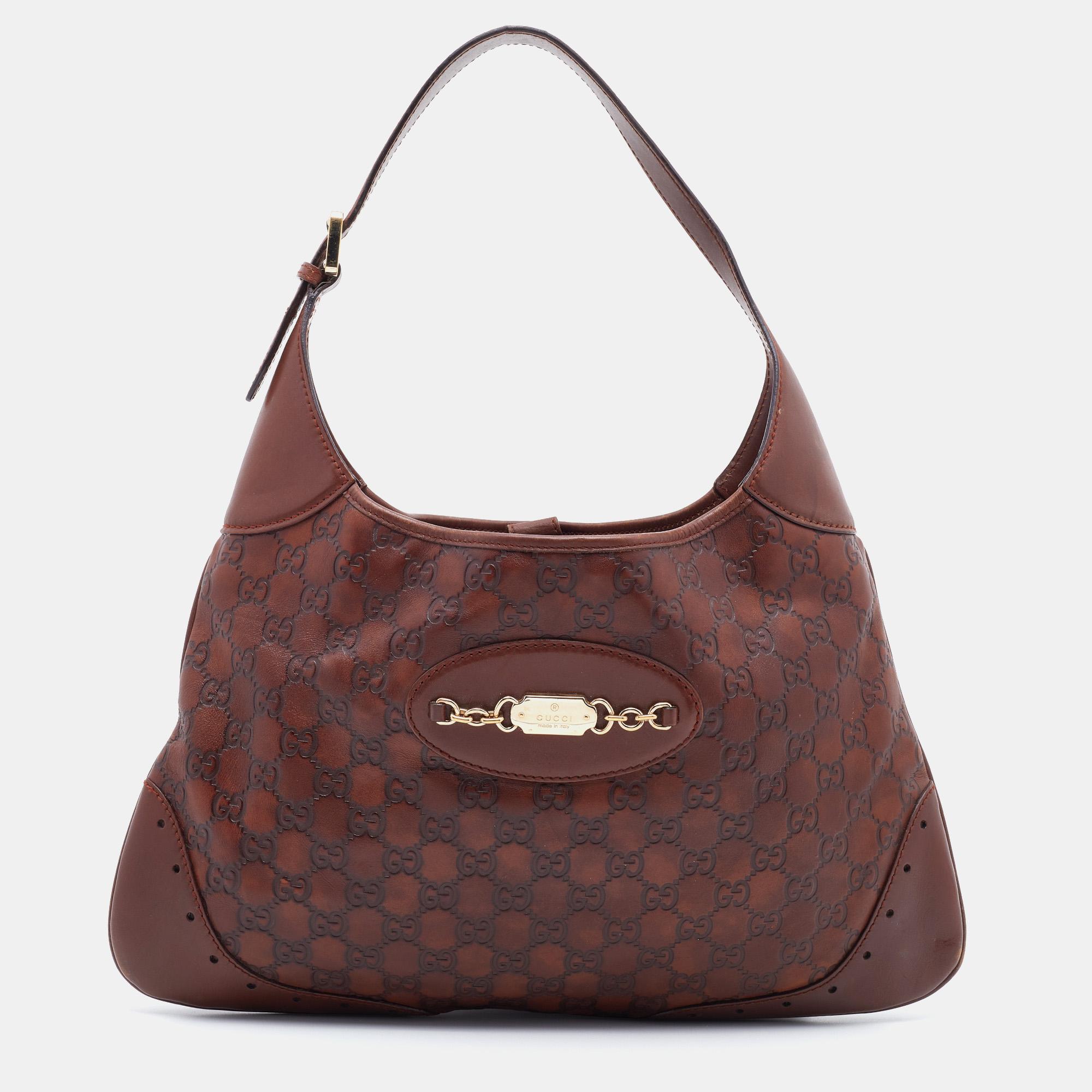 Simple details, high quality, and everyday convenience mark this Punch hobo by Gucci. The bag is made of Guccissima leather, and it features a single handle, gold-tone metal accents, and a spacious interior.
