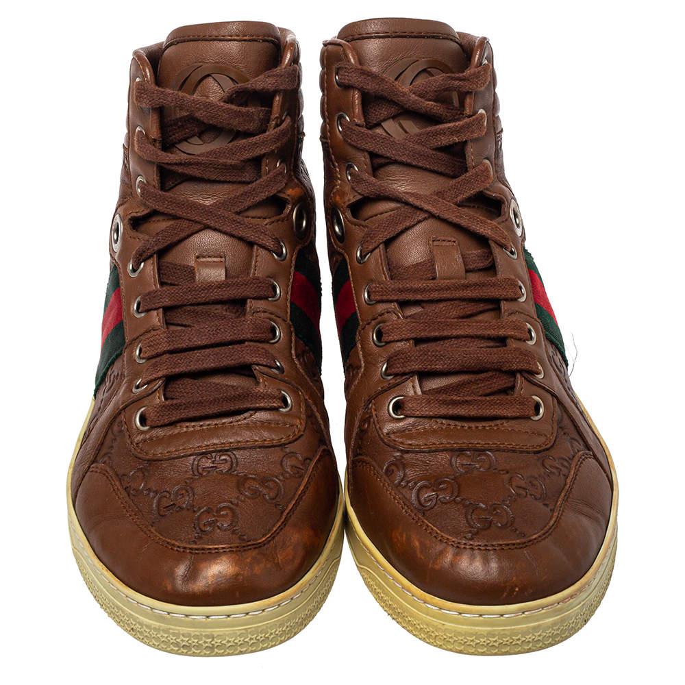 Flaunt a cool look with this pair of smartly crafted lace-up sneakers by Gucci. Designed using Guccissima leather, this pair of high-top shoes are perfect for making a casual fashion statement that can make you the center of attention at all times.


