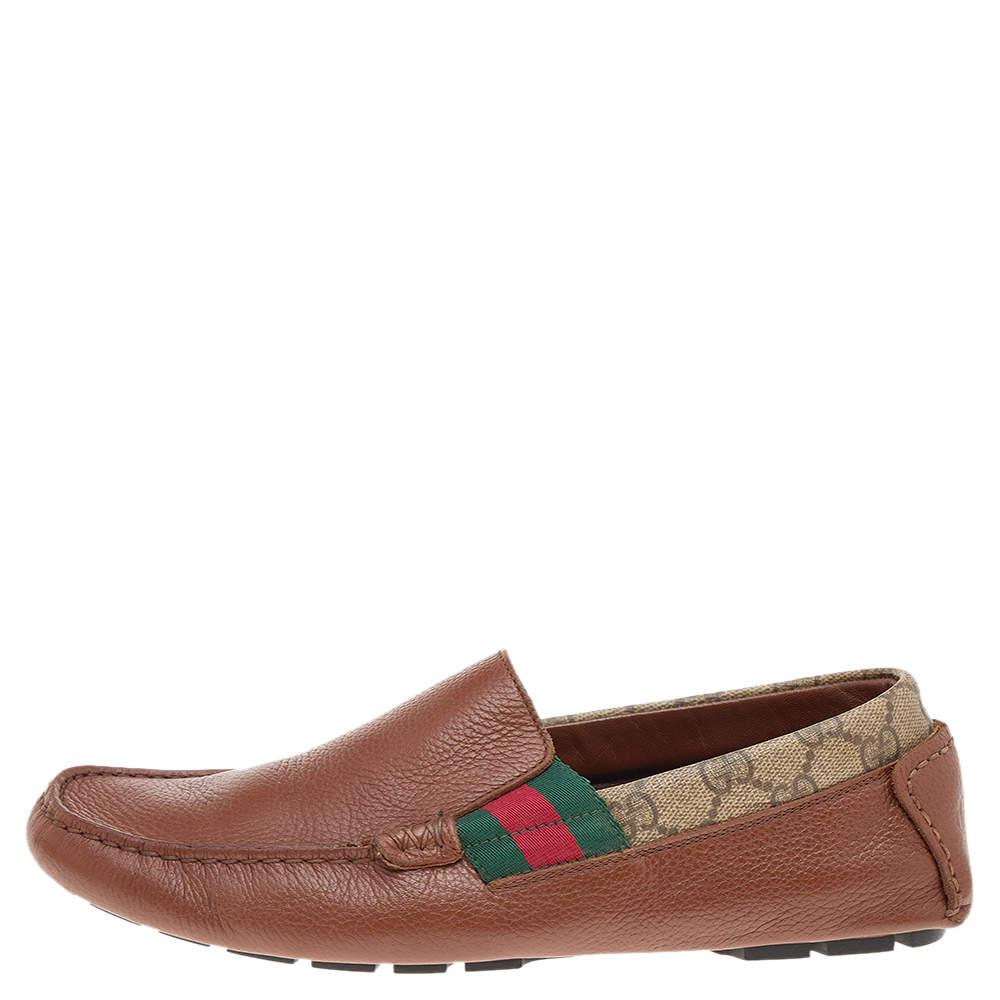 Brimming with iconic details of the House, these loafers from Gucci bring signatory excellence and aesthetics to your feet. These loafers are created using brown leather and GG coated canvas on the exterior, with the Web Stripe detail highlighting