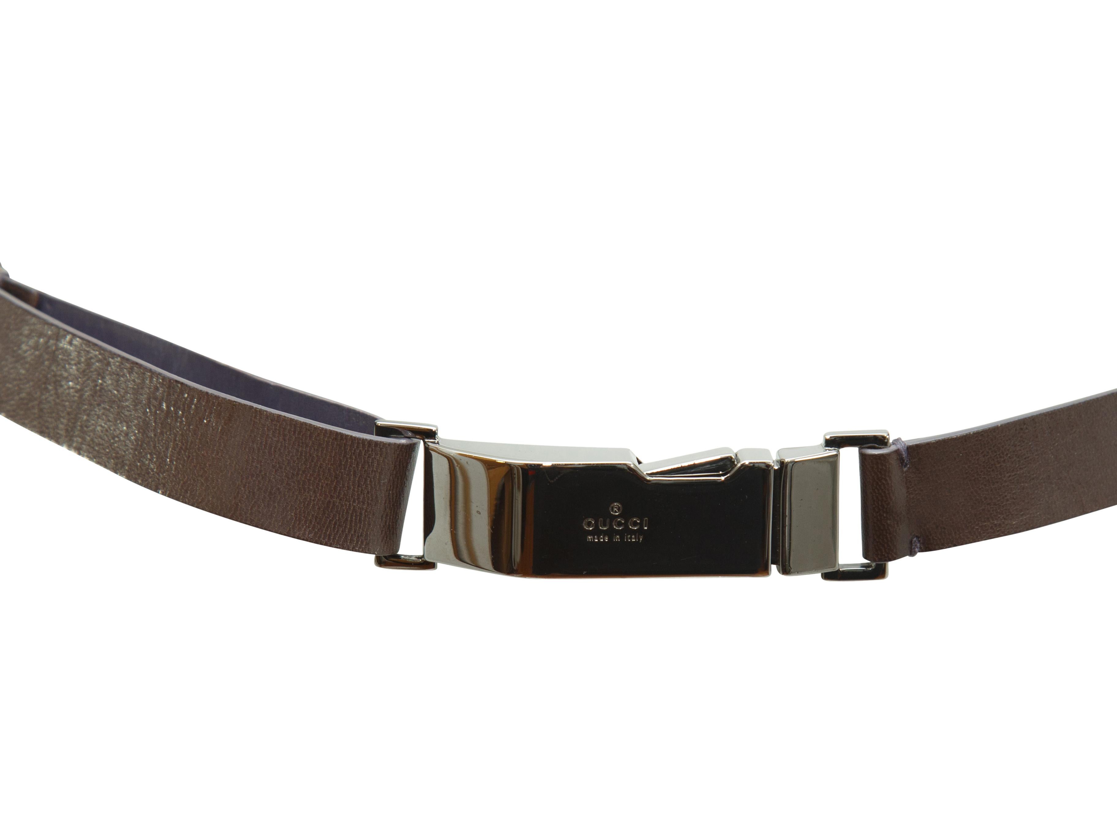 Product details:  Brown leather belt by Gucci.  Push buckle closure.  Silvertone hardware.  24.5