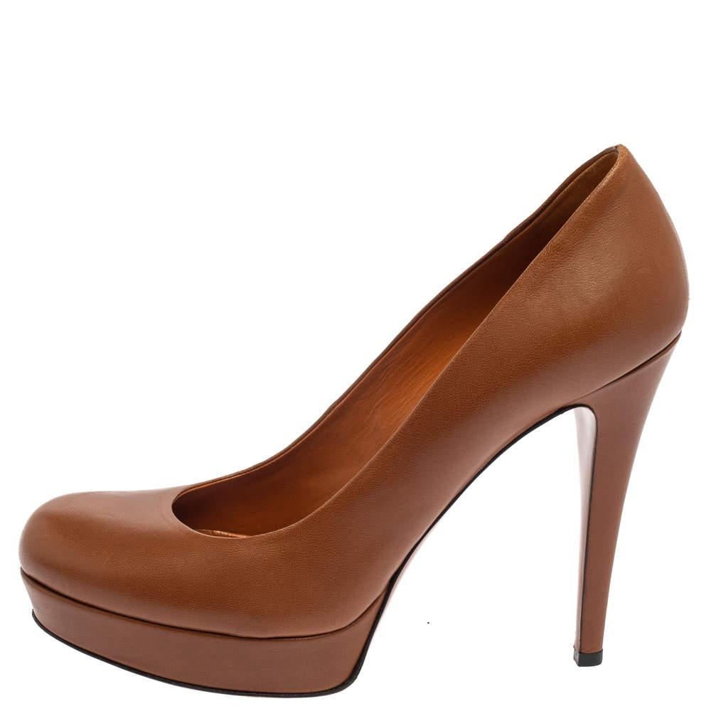These lovely pumps from Gucci are an ideal choice as they are stylish and comfortable. They are made of brown leather and designed with round toes. They are amazing for parties and work settings and stand elevated on platforms and 11.5 cm heels.