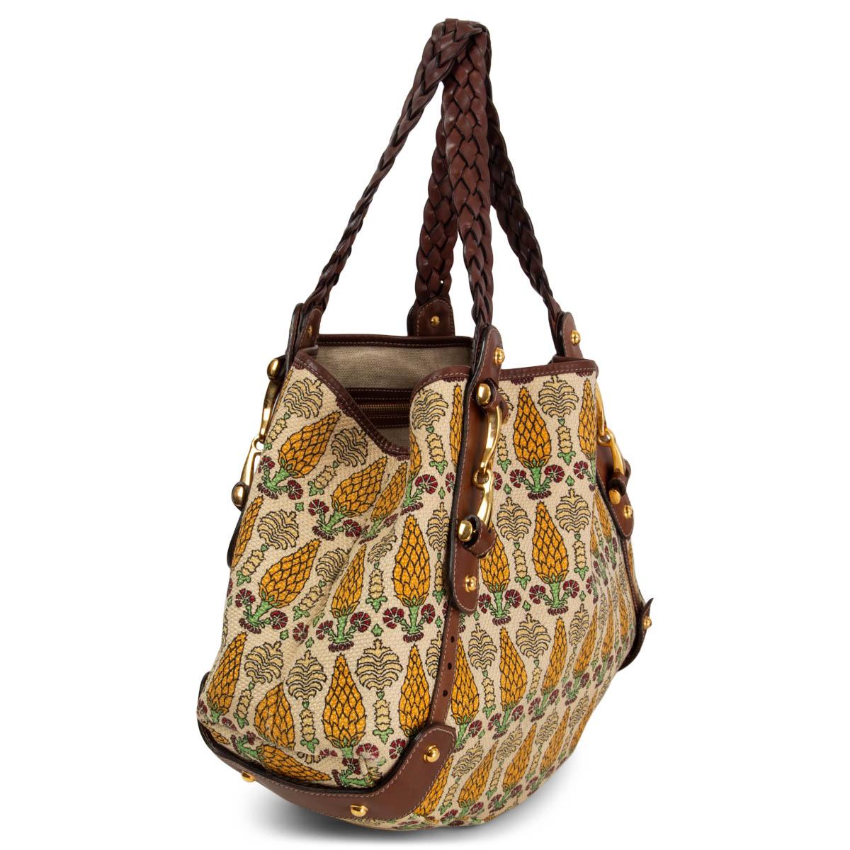 100% authentic Gucci Pelham 'Gucci Garden' shoulder bag in deep yellow, pale yellow, cream, green and red pigna printed canvas featuring brown leather trimming and braided shoulder-straps. Gold-tone metal hardware and horse-bit metal details. Has
