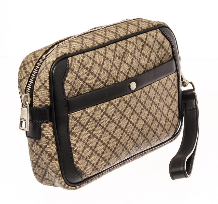 gucci brown leather diamante mens clutch bag with printed, silver-tone hardware, wrist strap, leather trim embellishment & single exterior pocket,canvas lining & single interior pocket with card slots, zip closure at top

83114MSC