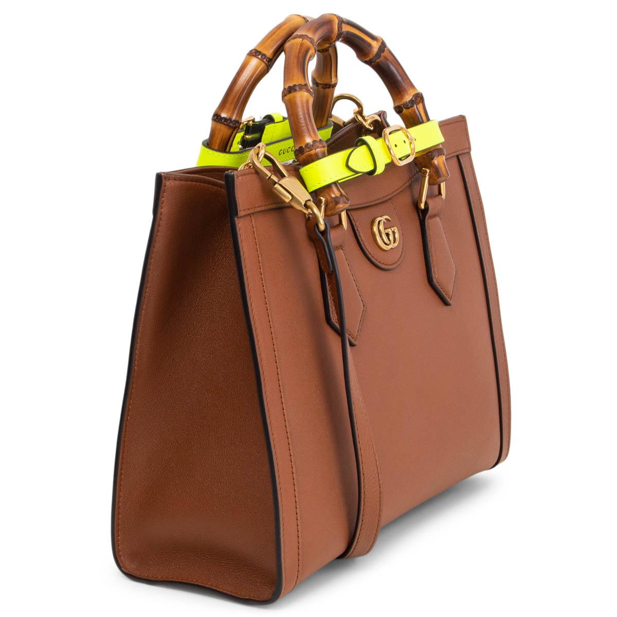 100% authentic Gucci Diana Small Tote Bag in brown calfskin, combining recognizable elements of the House, the small tote bag is defined by its bamboo handles and gold-tone Double G hardware. The bag is further accentuated by two yellow neon straps,