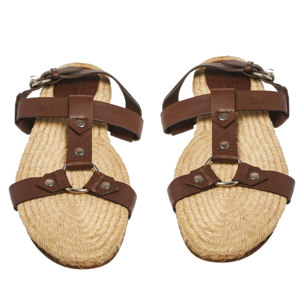 Gucci's leather sandals rest on a woven jute sole that recalls the historic espadrille style, dating back to the 13th century. They're made with slender straps and secured with buckles. Team them with summer separates for a joyful edit.

