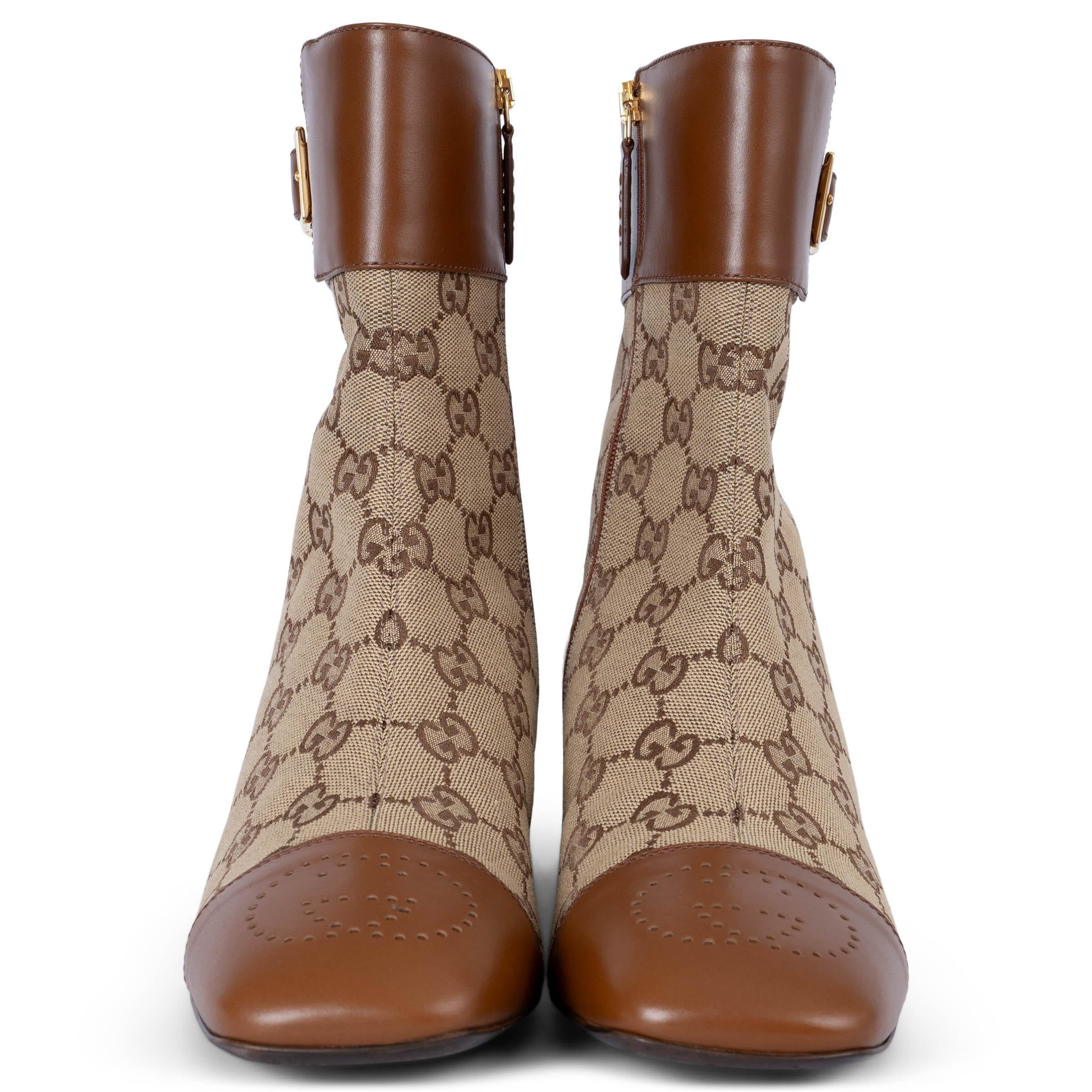 100% authentic Gucci Ellis ankle boots in beige and ebony GG Supreme canvas. Feature brown leather toe caps with perforated GG, leather trim around the ankle with gold-tone buckle and block heels with metallic gold detail on the inside. Closes with