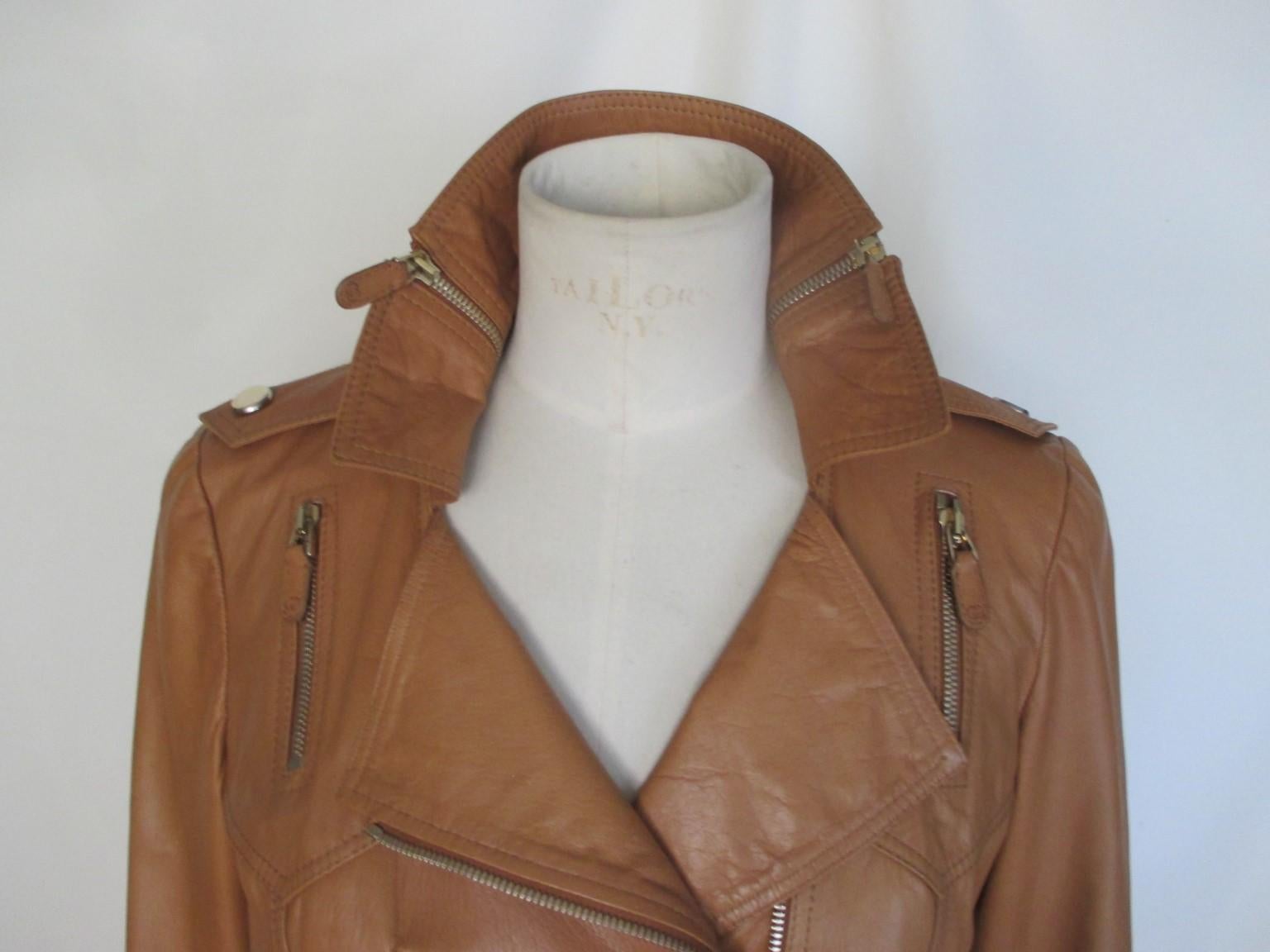 This Gucci mustard brown leather jacket is designed with a lot of zippers

We offer more Gucci, Hermes and exclusive Fur items, view our frontstore.

Details:
Made of brown quality leather, 
With a closing zipper, attached belt, 2 side zipper with 2