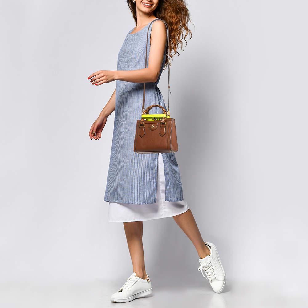 With a Gucci bag by your side  its going to be a stylish OOTD no matter the day. Here  we have this Gucci Mini Diana bag just for you. Its compact shape  notable details  and simple elegance make it a worthy purchase and a versatile accessory.