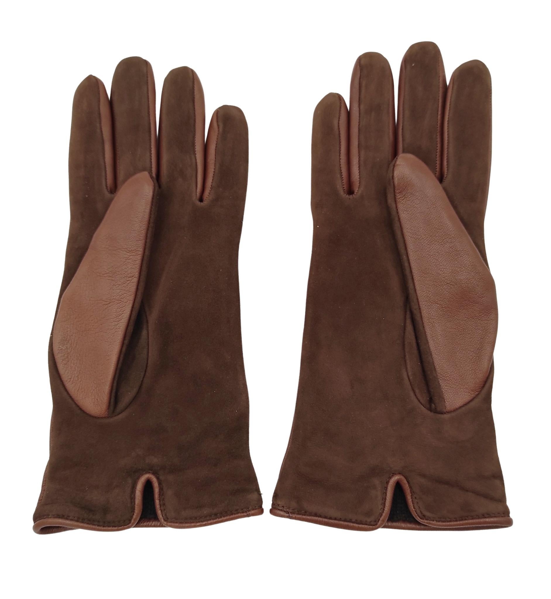 Gucci gloves
Brown leather and suede
Silver metal logo
Cashmere lining

Size 8 (L)

Excellent condition
Never used