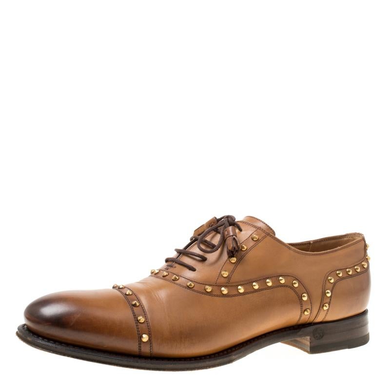 Give your personality a smart touch by wearing this most attractive pair of shoes from Gucci. These oxfords with a powerful appeal are designed in a tan colour, stud detailing all over, and offer a bold finish. Their amazing leather construction
