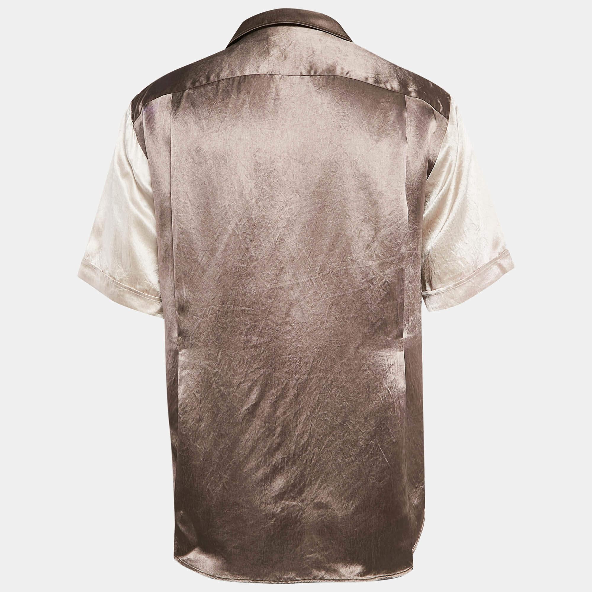 The Gucci Hawaii Bowling shirt is a stylish fusion of retro charm and contemporary luxury. This shirt is made from smooth satin and features a relaxed  boxy fit in a rich brown color  complemented by Guccis iconic logo appliquÃ© on the chest.