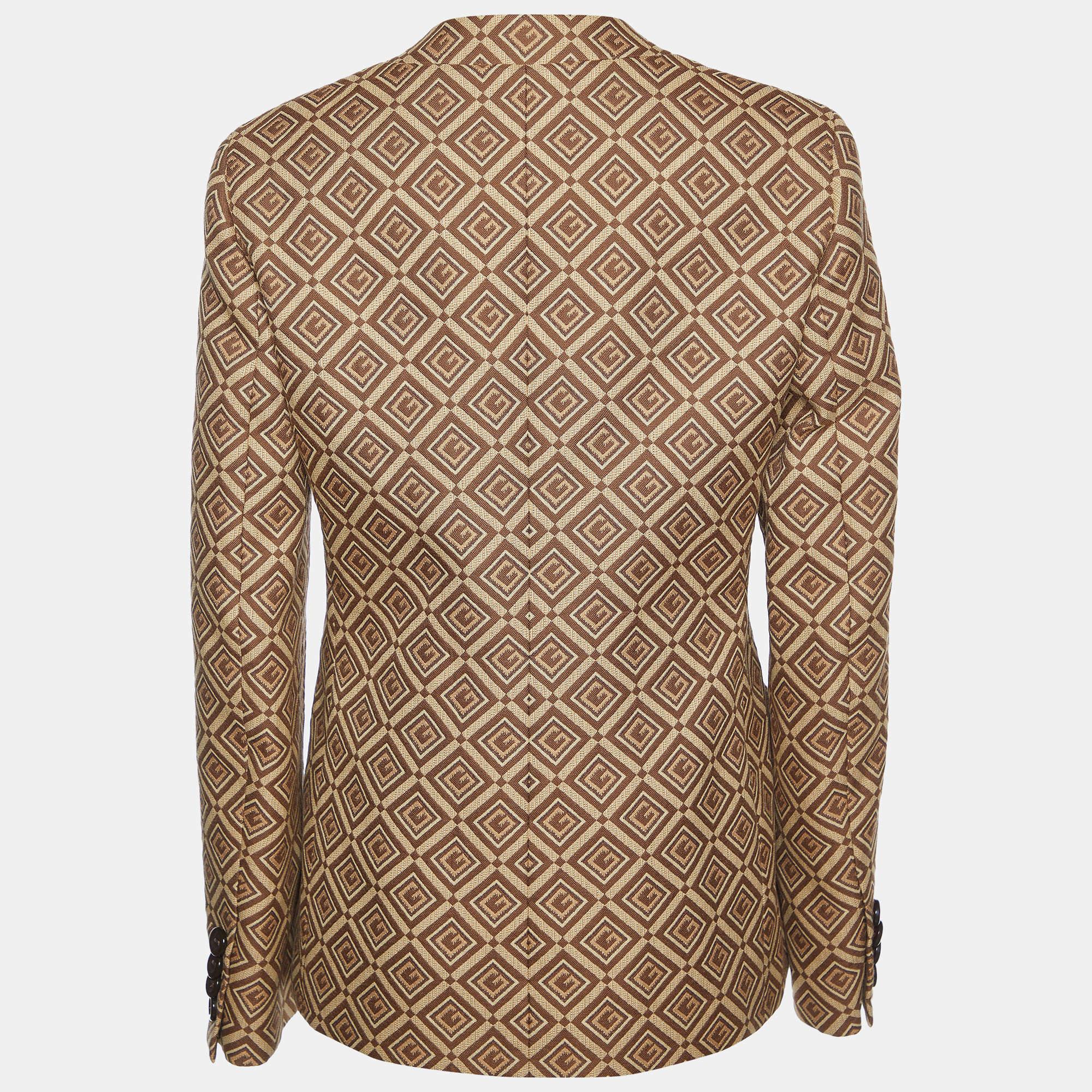 The Gucci blazer is a luxurious and sophisticated piece. Crafted from high-quality cotton, it features a classic double-breasted design adorned with the iconic Gucci logo jacquard pattern. This elegant blazer exudes timeless style and makes a