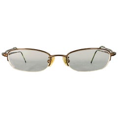 Occhiali da vista senza montatura in metallo marrone Gucci