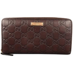 Gucci Brown Monogram Embossed Leather Zip Pocket Book Wallet