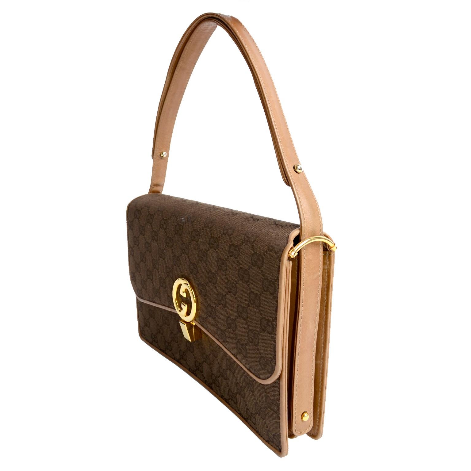 This is a beautiful 1980's Vintage Gucci handbag in a brown Gucci monogram print. This wonderful bag measures 10