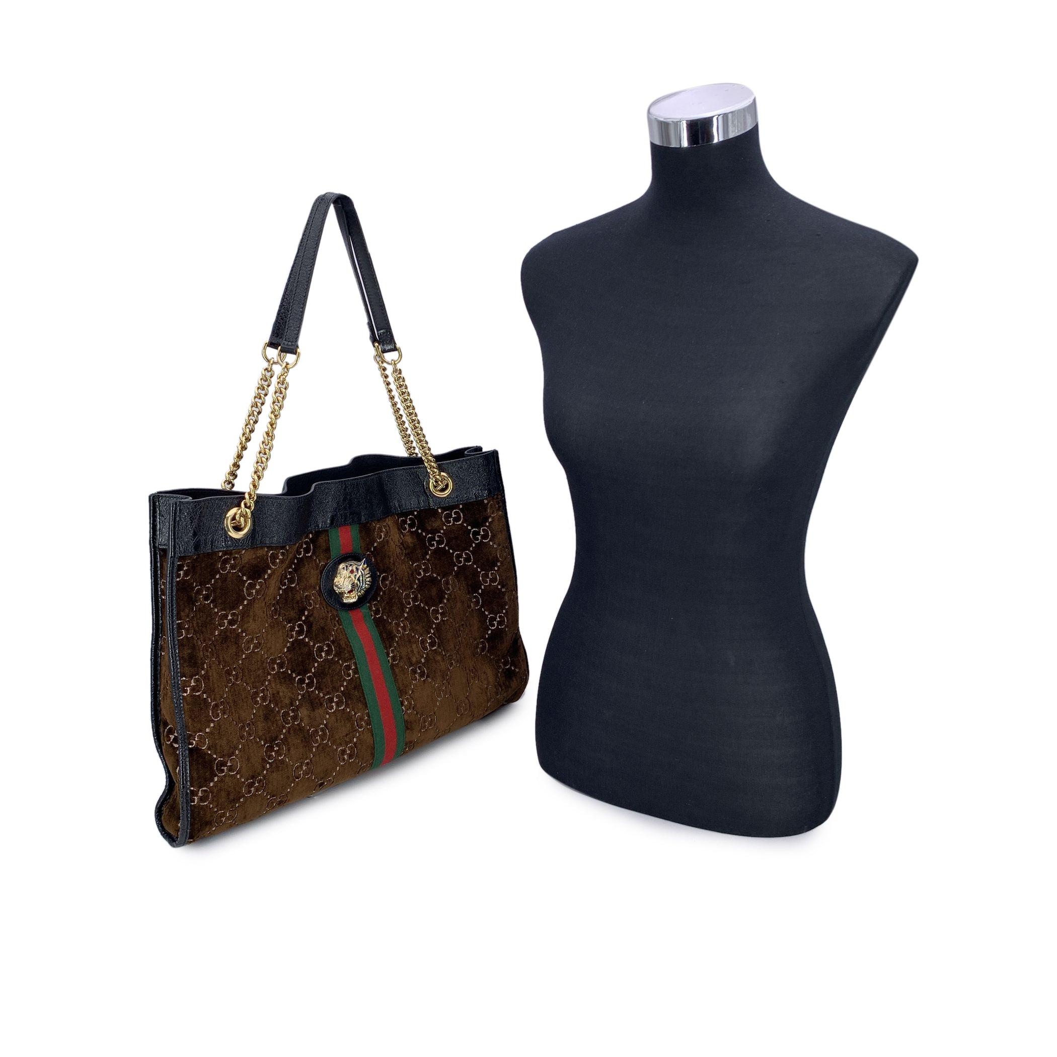 This stunning Gucci 'Rajah' Large Tote is a true testament to luxury craftsmanship, designed to capture the essence of timeless elegance. Crafted from rich brown cut-out velvet, the bag is adorned with the signature GG - GUCCI monogram pattern,
