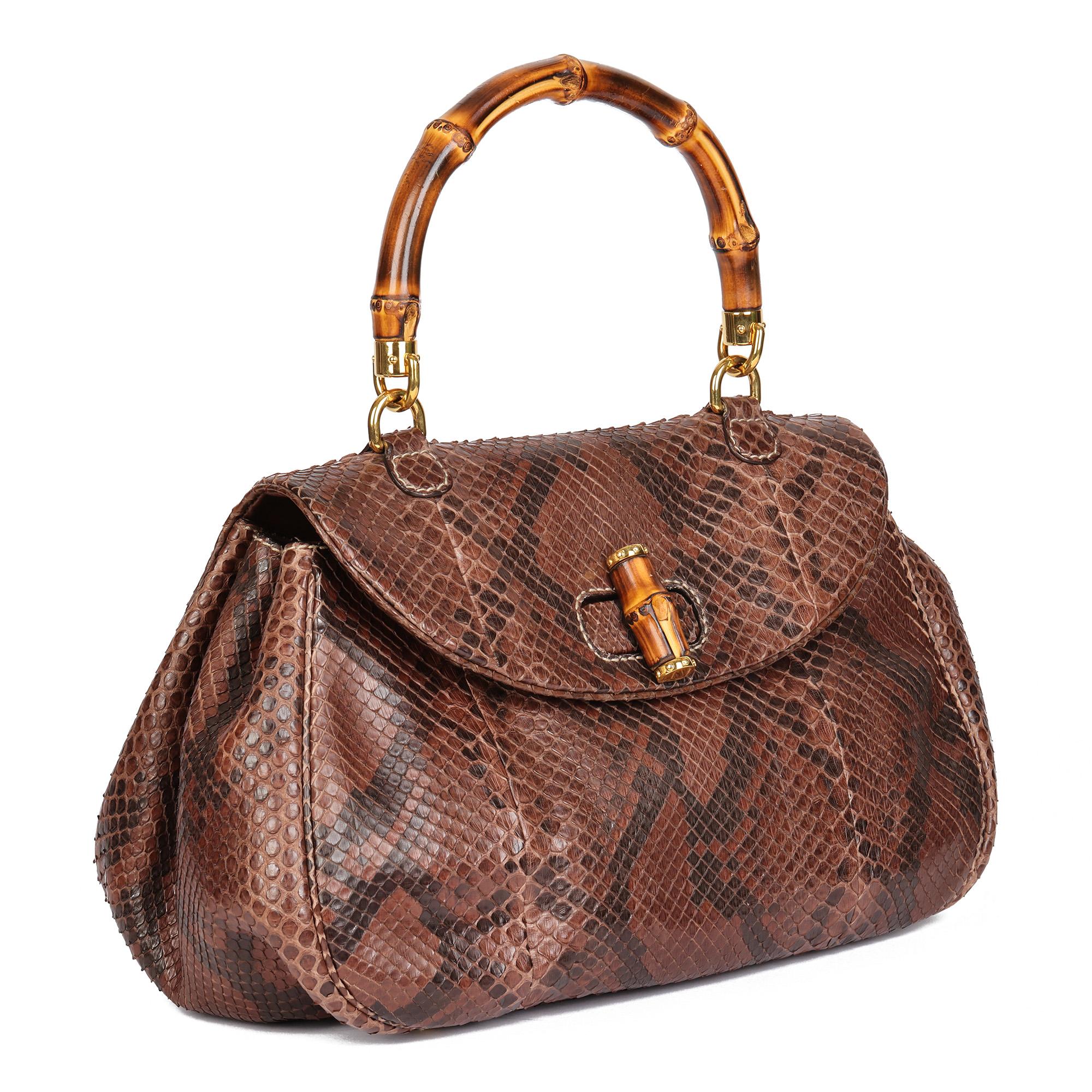 GUCCI
Brown Python Leather Vintage Bamboo Classic Top Handle

Serial Number: 195436 02026
Age (Circa): 1990
Accompanied By: Gucci Care Booklet
Authenticity Details: Date Stamp (Made in Italy)
Gender: Ladies
Type: Top Handle

Colour: Brown
Hardware: