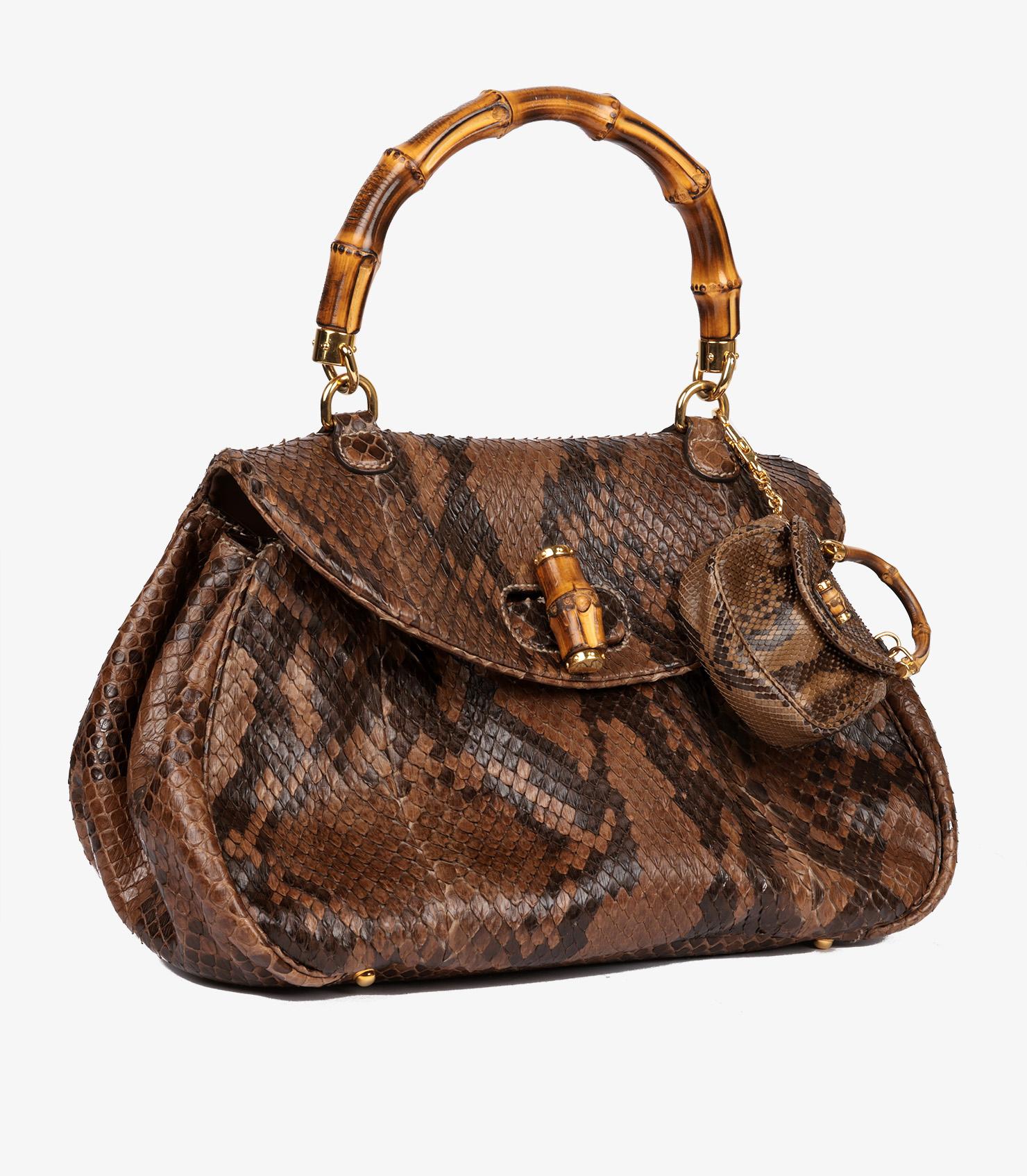 Gucci Brown Python Leather Vintage Large Classic Bamboo Top Handle with Micro Charm

Product Details
Xupes Ref: CB1207
Brand: Gucci
Model: Large Classic Bamboo Top Handle
Type: Top Handle
Serial Number: 195436-000926
Accompanied By: Gucci Dust Bag,