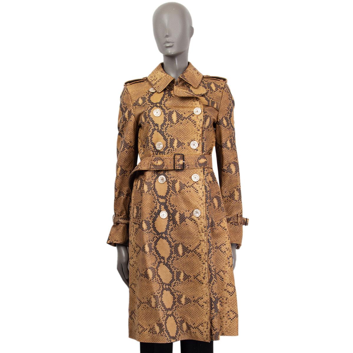 Gucci python print trench coat in pale mustard, light brown, black and bronze lamb leather with a notch collar, buttoned epaulettes, slit pockets and a matching belt. Has bronze tone leather border finishing. Closes on the front with buttons. Lined