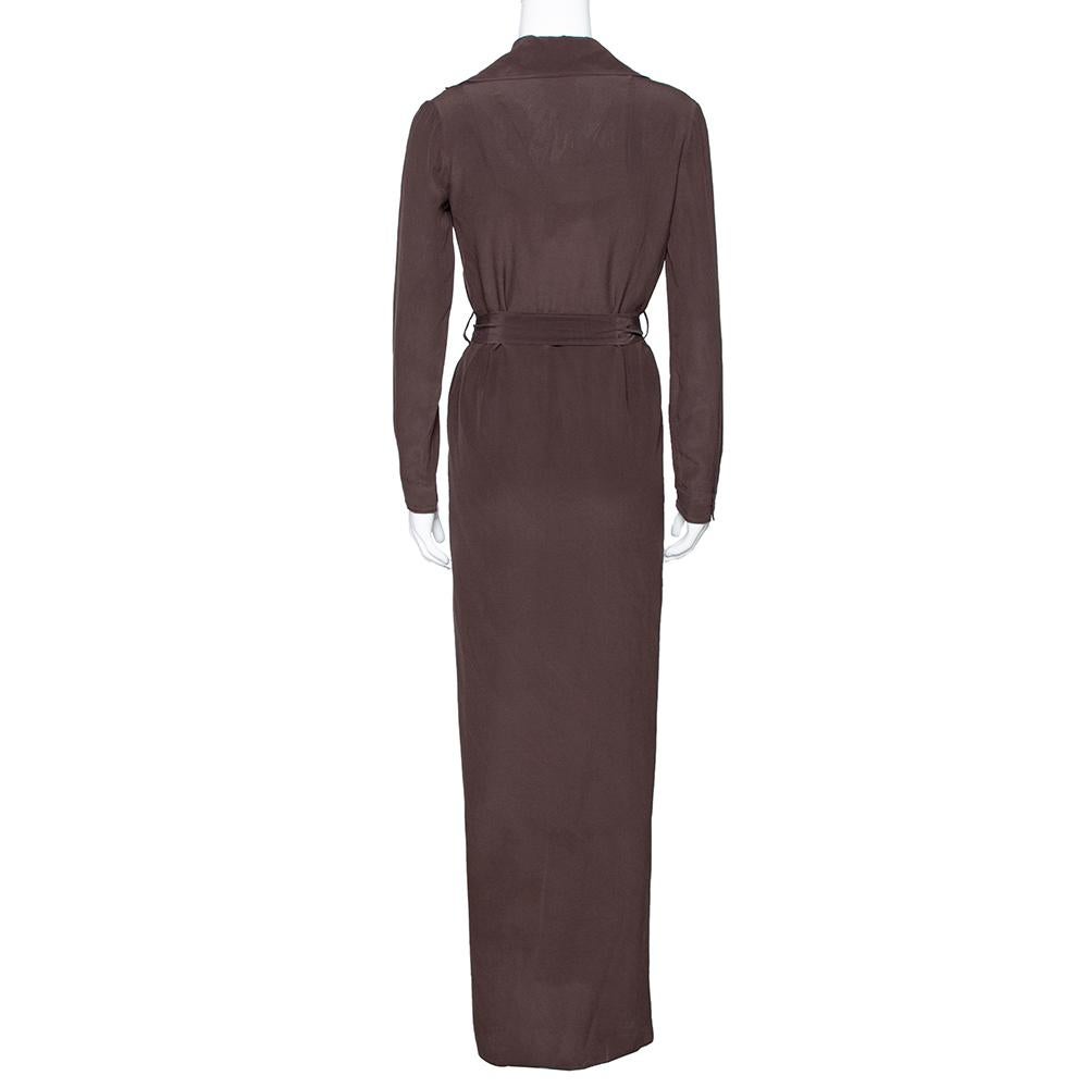 Sophisticated and posh, this stylish number by Gucci has been designed to deliver style goals that will never be forgotten. Crafted from pure silk, this luxurious item carries a solid brown exterior. It is equipped with a v-neck, button-down front,