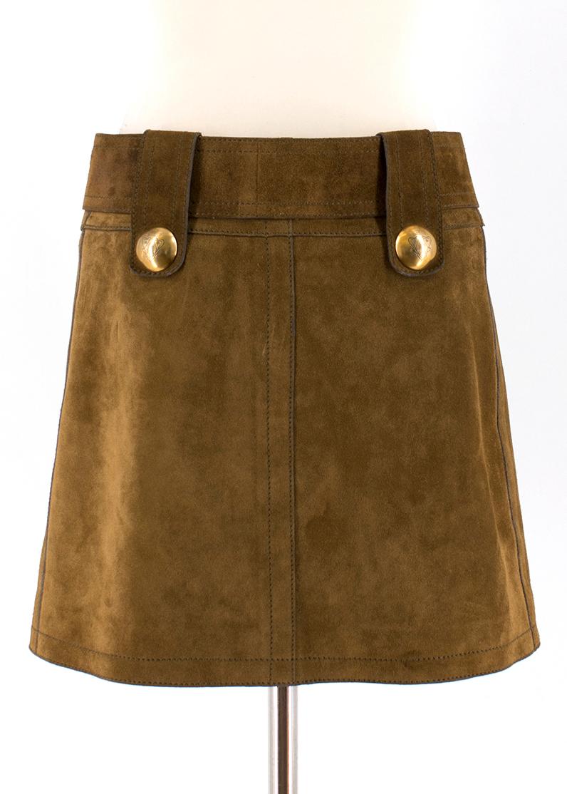 Gucci Brown Suede Skirt

- Brown suede skirt
- Mid-weight
- Centre-front stud snap fastening with logo engraved
- Belt-loops with detachable belt
- Gold-tone hardware
- Above-the-knee length
- Gucci embroidered lining

Please note, these items are