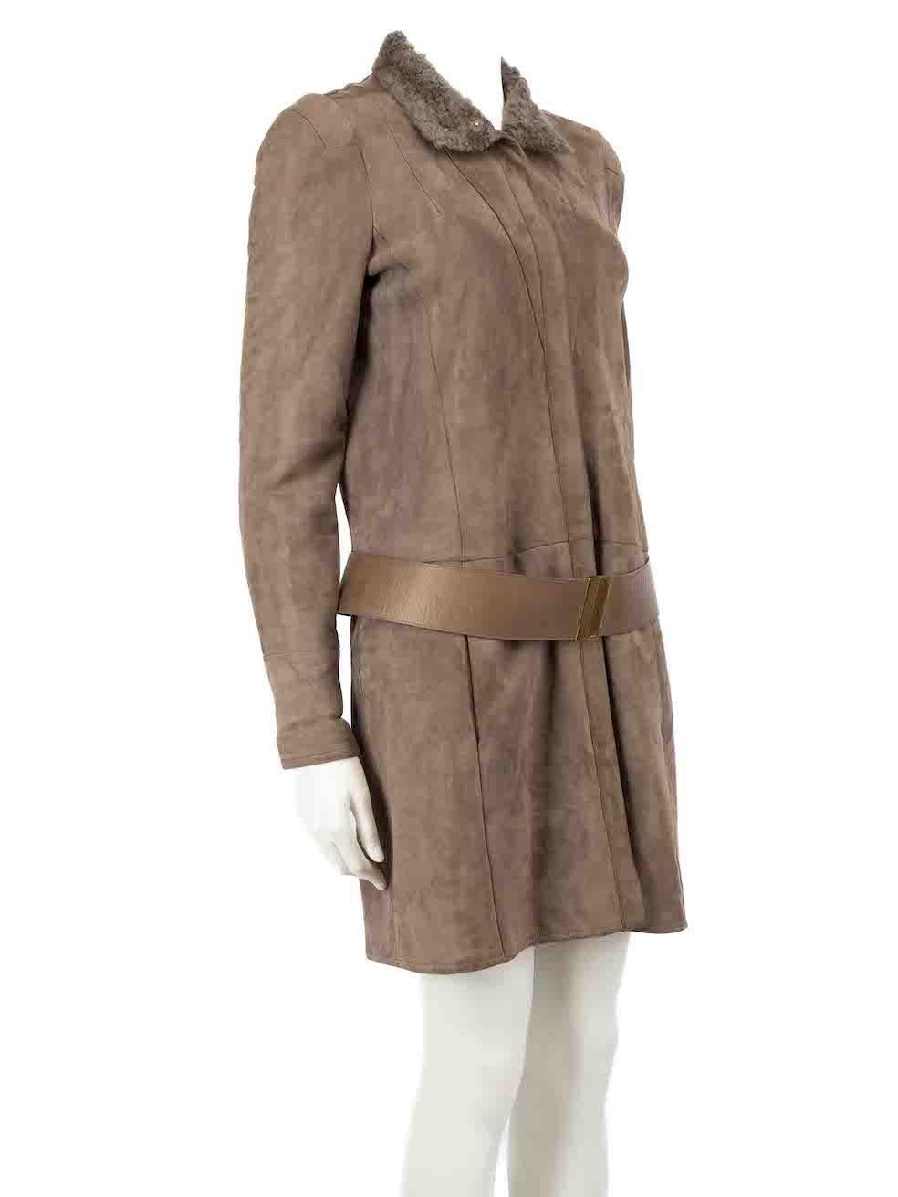 CONDITION is Very good. Minimal wear to the coat is evident. There is some pilling to the underside sleeves, and some scratches to the metal hardware on this used Gucci designer resale item.
 
Details
Brown
Suede
Coat
Shearling lined
Zip