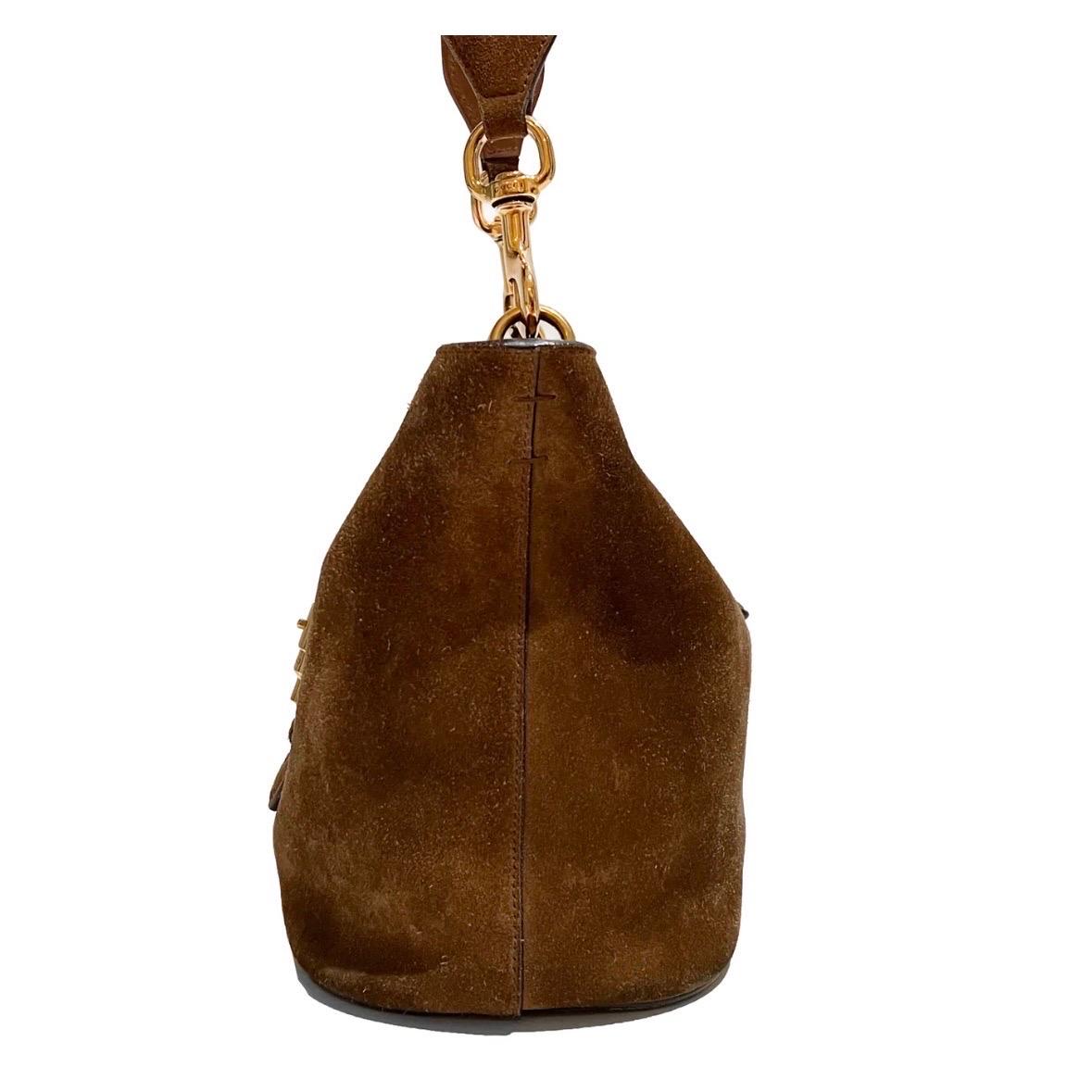 Product Details:
Brown Suede Jackie Bucket Bag by Gucci
Spring / Summer 2015
Made in Italy
Soft brown suede
Bucket style Jackie bag
Fold over strap with button clasp closure
Includes dual interchangeable shoulder straps
Cross body signature