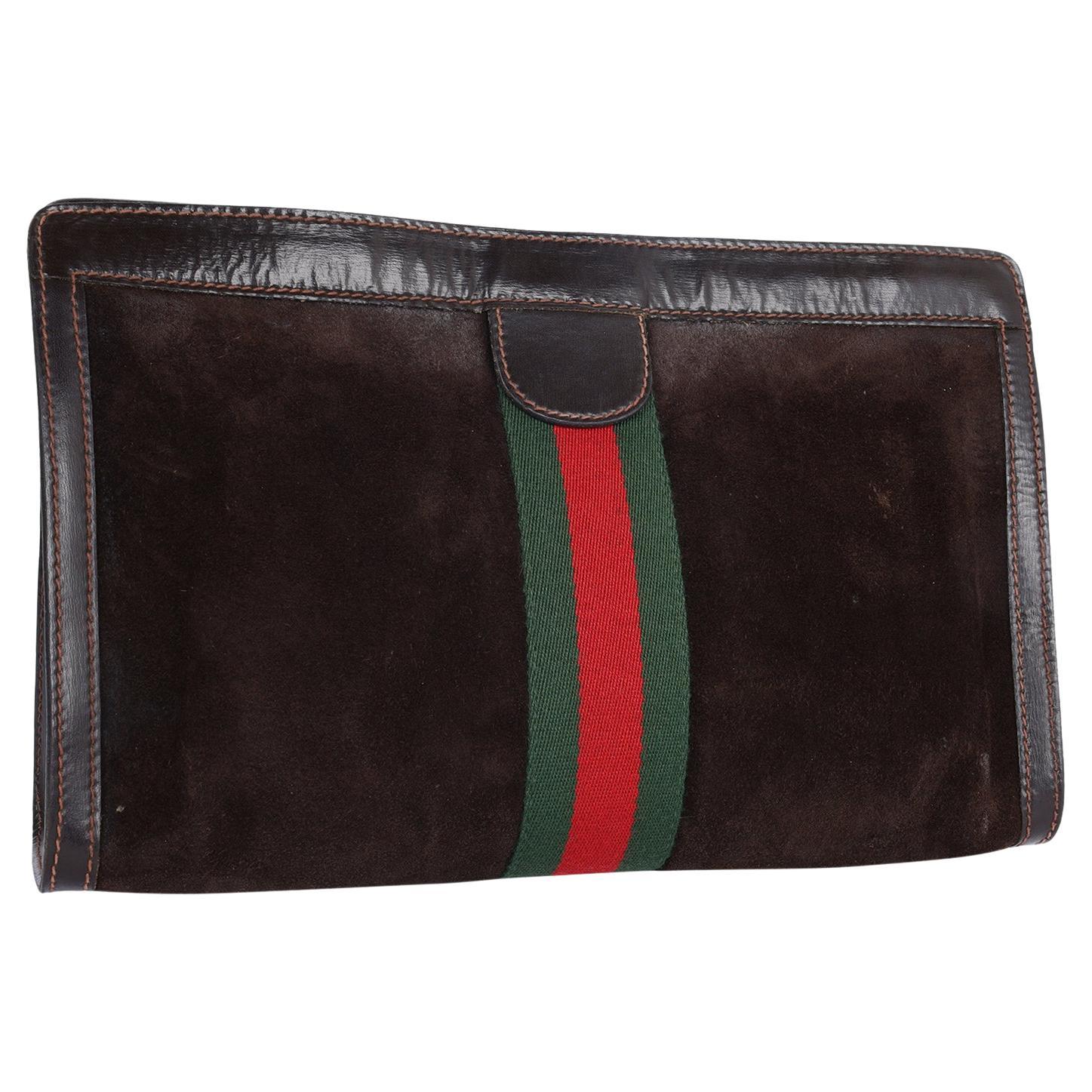 Authentic, pre-loved Gucci Brown Suede Leather Ophidia clutch or toiletry case. Features brown suede with leather trim, web design, velcro closure, large interior with waterproof lining. This is a marvelous cosmetics case that is practical and chic,