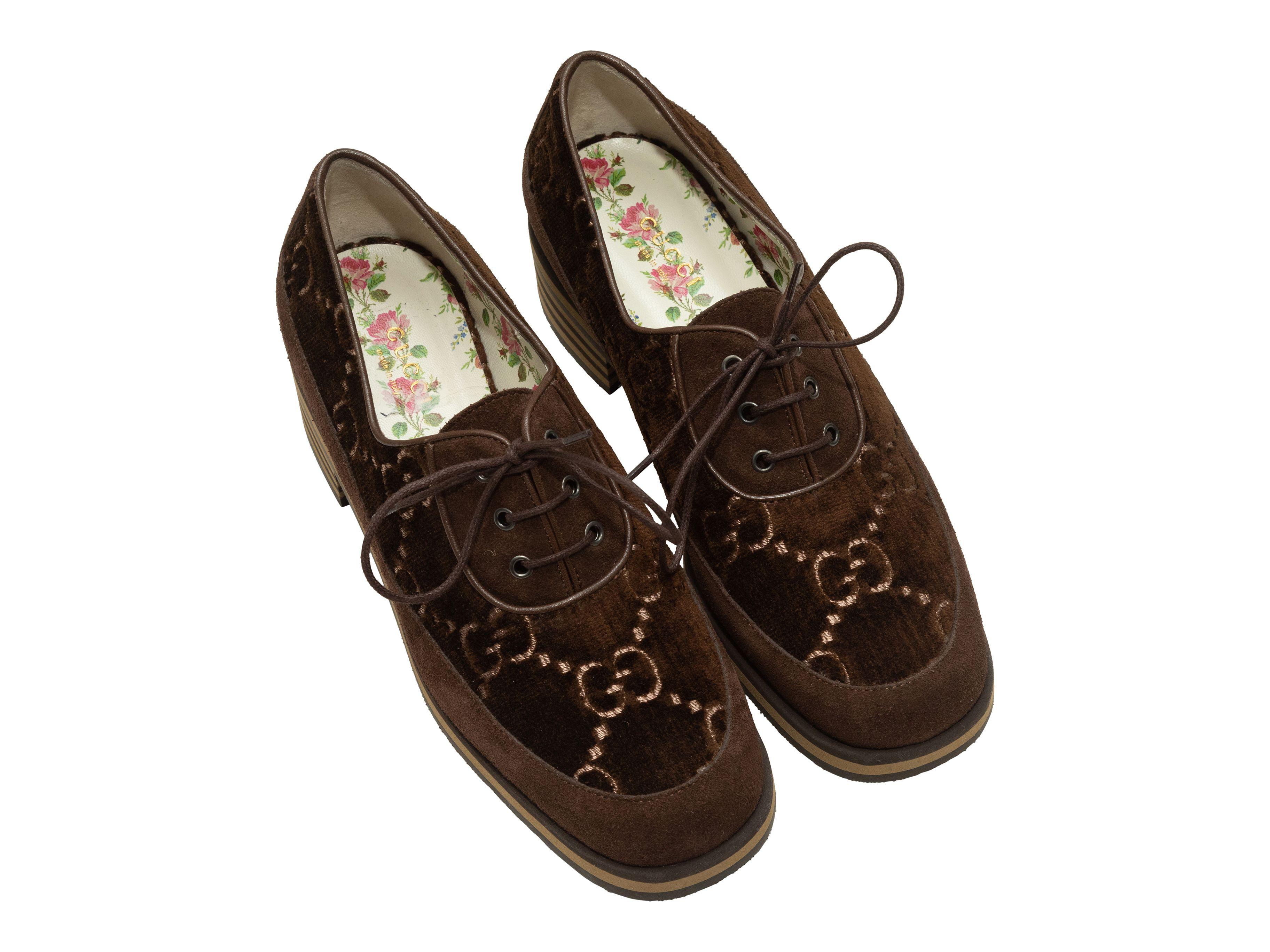 Product Details: Brown suede and velvet GG oxfords by Gucci. Gold bee embroidery at counters. Foam rubber soles. Lace-up tie closures at tops. 1.75
