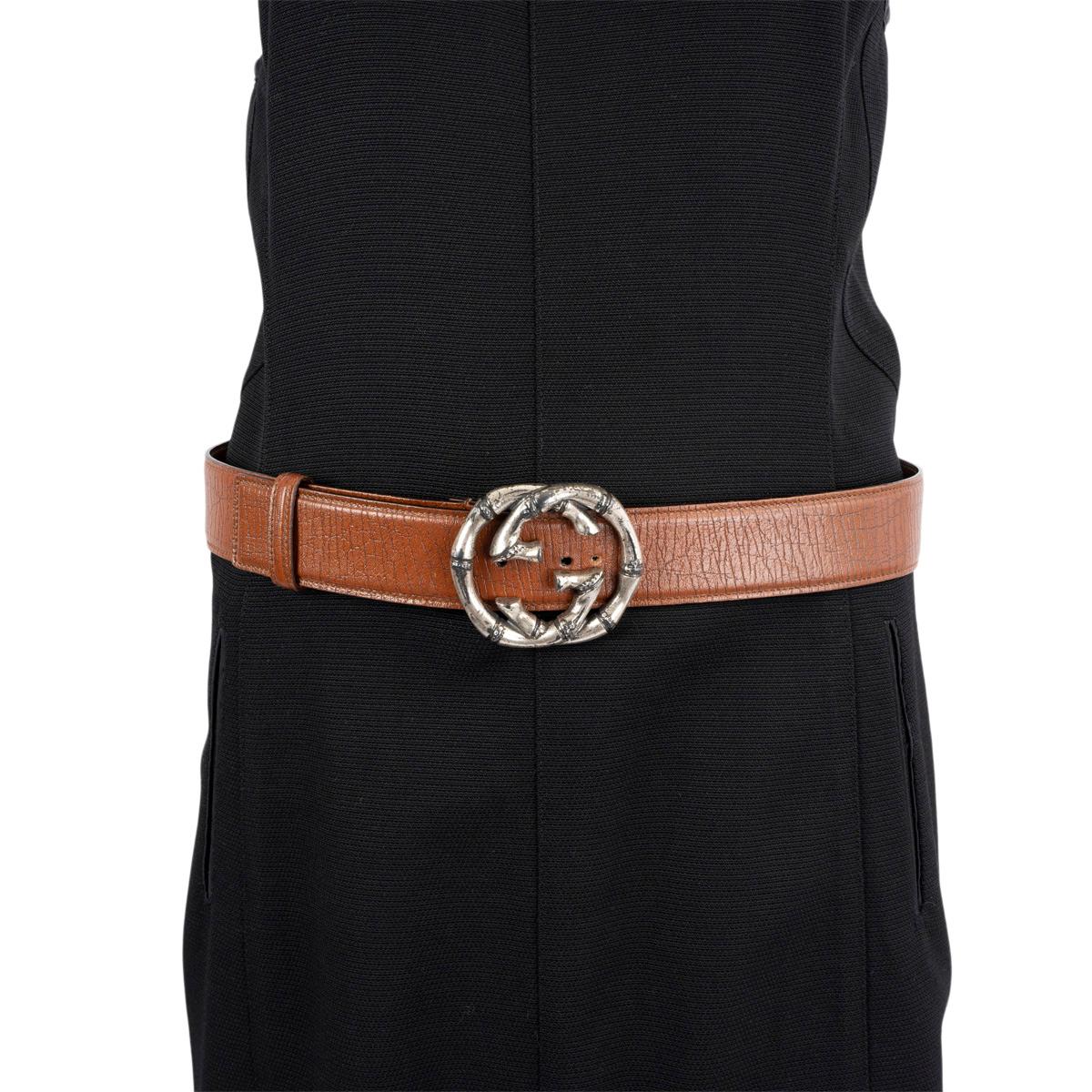 100% authentic Gucci belt in brown textured leather with antique silver GG bamboo buckle.Has been worn and an extra hole got added. Overall in excellent condition. 

Measurements
Model	114868 212956
Tag Size	85
Width	4cm (1.6in)
Fits	82cm (32in) to