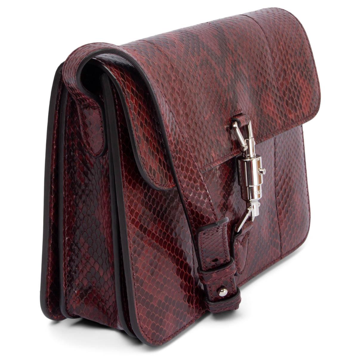 100% authentic Gucci Jackie Soft Flap shoulder bag in burgundy python snakeskin featuring silver-tone piston push-lock closure that opens to a roomy nude suede lined interior. Has been carried once and is in virtually new condition. Comes with dust