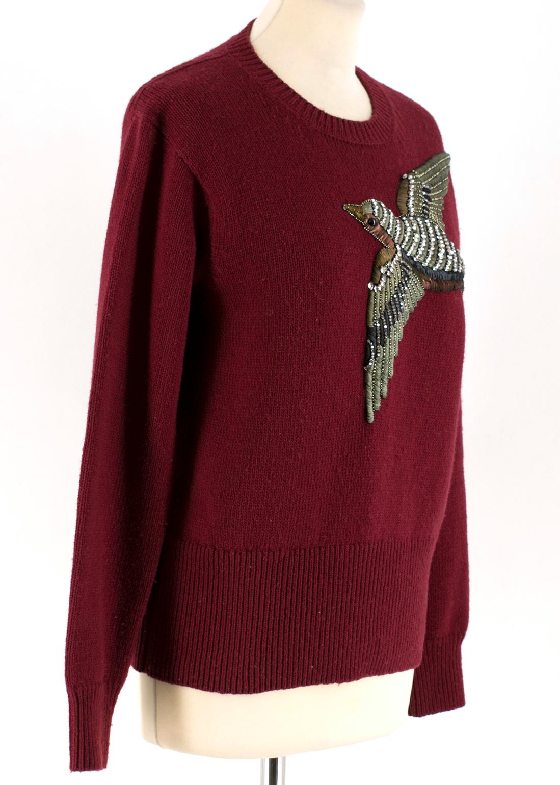 Gucci Burgundy Bird Embellished Knit Wool Sweater

- Wool burgundy sweater
- Round neckline
- Bird embellishment made of silk ribbon and white crystals

Please note, these items are pre-owned and may show some signs of storage, even when unworn and