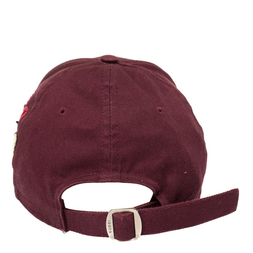 This burgundy-hued baseball cap from Gucci is a result of the Creative Director's love for the New York Yankees. It features a straight peak, a New York Yankees patch to the front, butterfly applique detail and an adjustable strap on the rear
