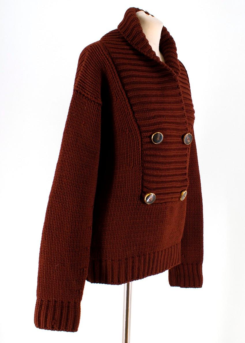 Gucci Burgundy Chunky Knit Sweater
 
 - Burgundy Sweater
 - Chunky Knit, ribbed edges
 - Shawl collar, long sleeved
 - Buttoned at neck
 - Gold tone and Stone buttons
 - Side slip pockets
 
 Please note, these items are pre-owned and may show some