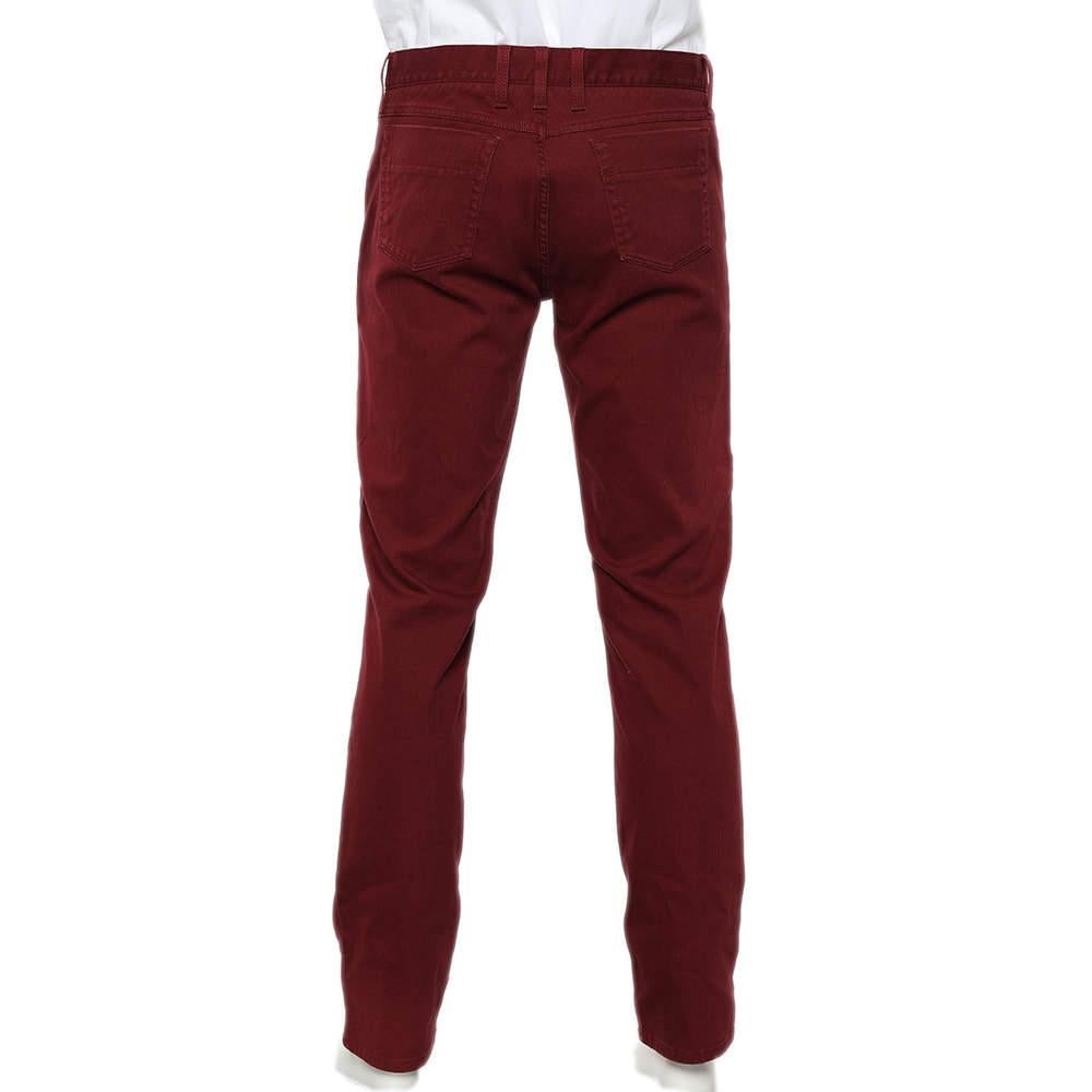Revamp your luxury collection by adding these classy and comfy jeans from the House of Gucci. They are designed from burgundy denim fabric into a skinny-fit silhouette. These jeans are equipped with a buttoned closure and five external pockets. Your