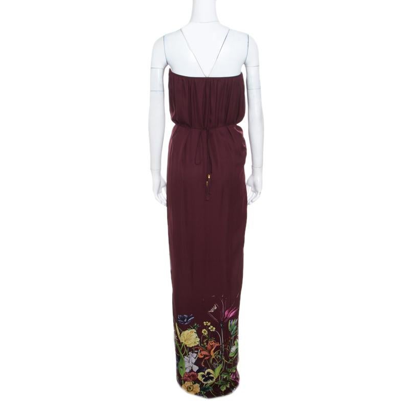 This strapless maxi dress from Gucci is what your wardrobe has been missing all this while! The burgundy creation is made of 100% silk and features a lovely floral print at the bottom. It flaunts a gathered silhouette and comes with a self-tie
