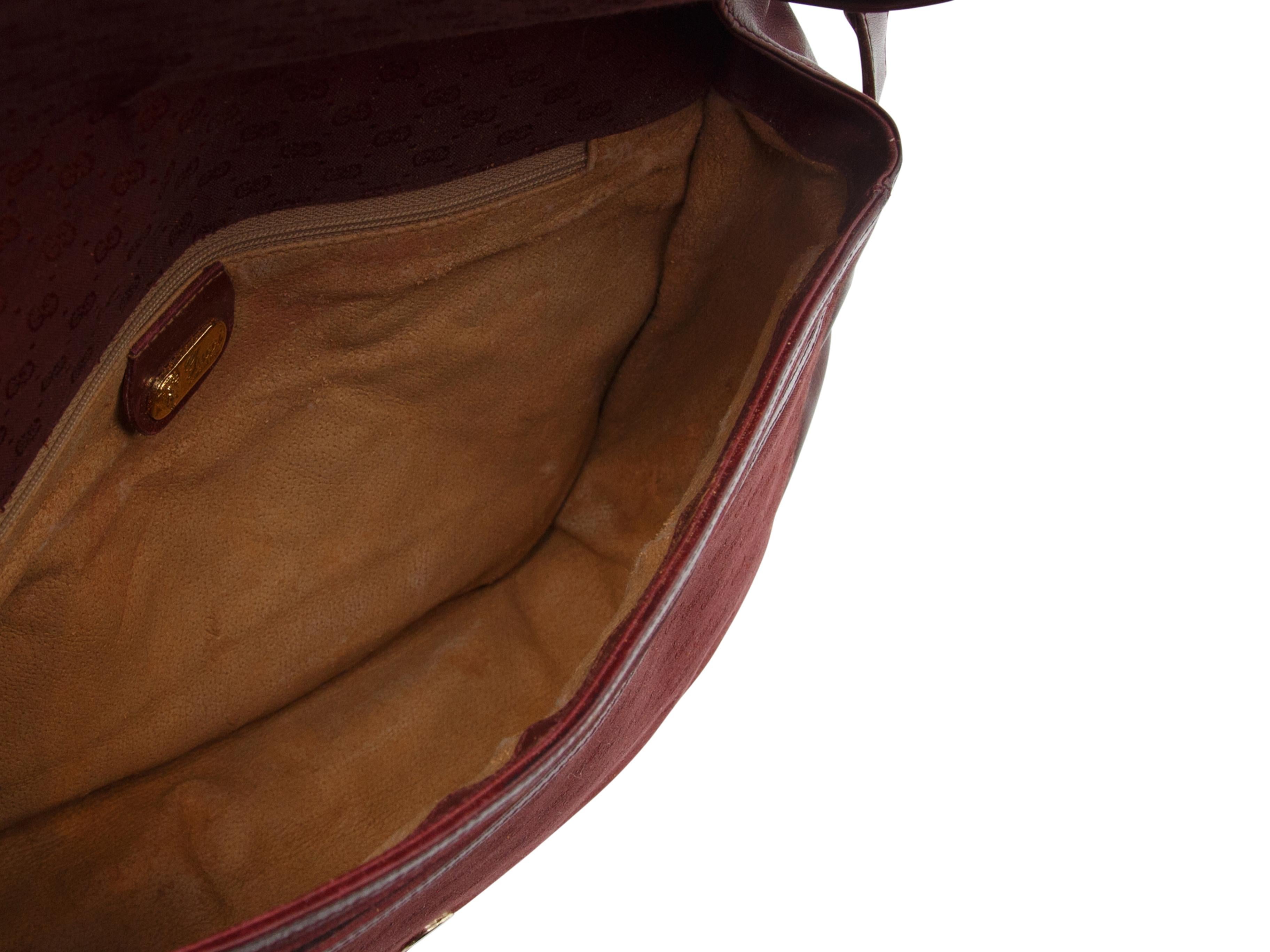 Product details: Burgundy Vintage Gucci Leather and Logo Messenger Bag. This vintage Gucci bag has an adjustable shoulder strap.  9