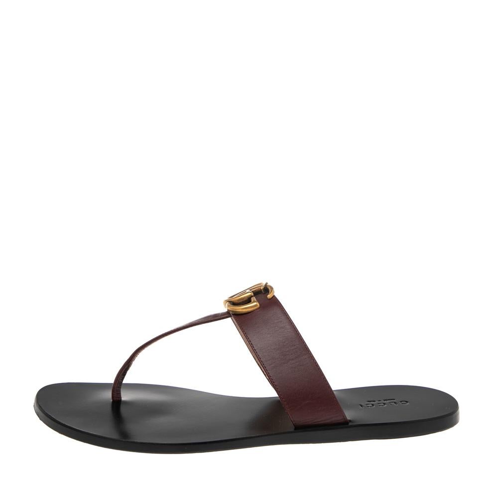 Step out summer-ready in this pair of thong sandals from Gucci. They've been crafted from burgundy leather and styled with a gold-tone GG logo at the front. Flaunt them with dresses and shorts.

Includes: Original Dustbag